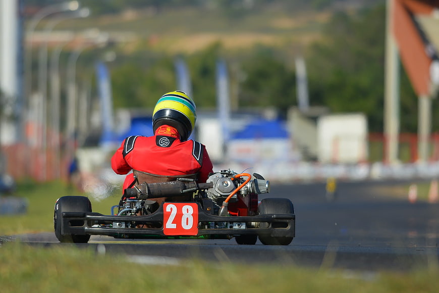 Rear view of go-kart number 28 on a race track