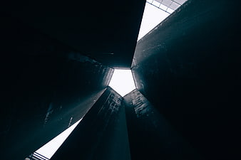 Low angle view of dark concrete architectural structure