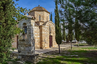 Traditional Stone Orthodox Church in Cyprus with Cypress Trees