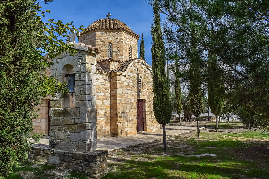 Traditional Stone Orthodox Church in Cyprus with Cypress Trees