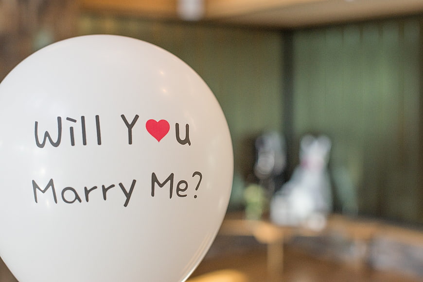 White balloon with 'Will You Marry Me?' proposal text