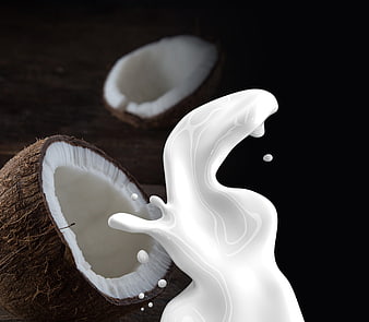 Dynamic Coconut Milk Splash with Fresh Coconut Halves