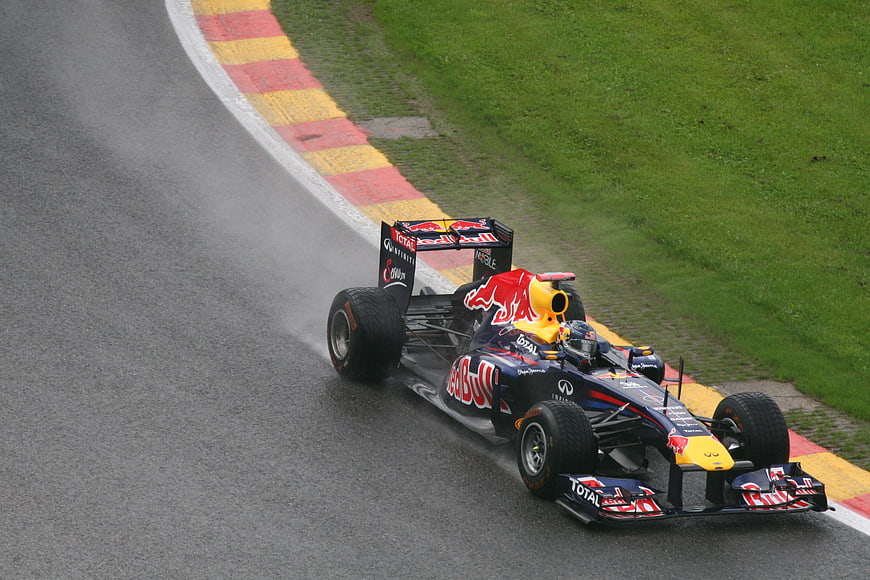 Red Bull Formula 1 Car Racing on Wet Track