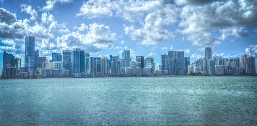 Miami Skyline Panorama Across Water with Blue Sky