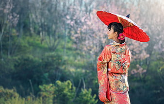 Woman in Red Kimono with Parasol Under Cherry Blossoms