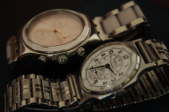 Vintage silver wristwatches on dark background