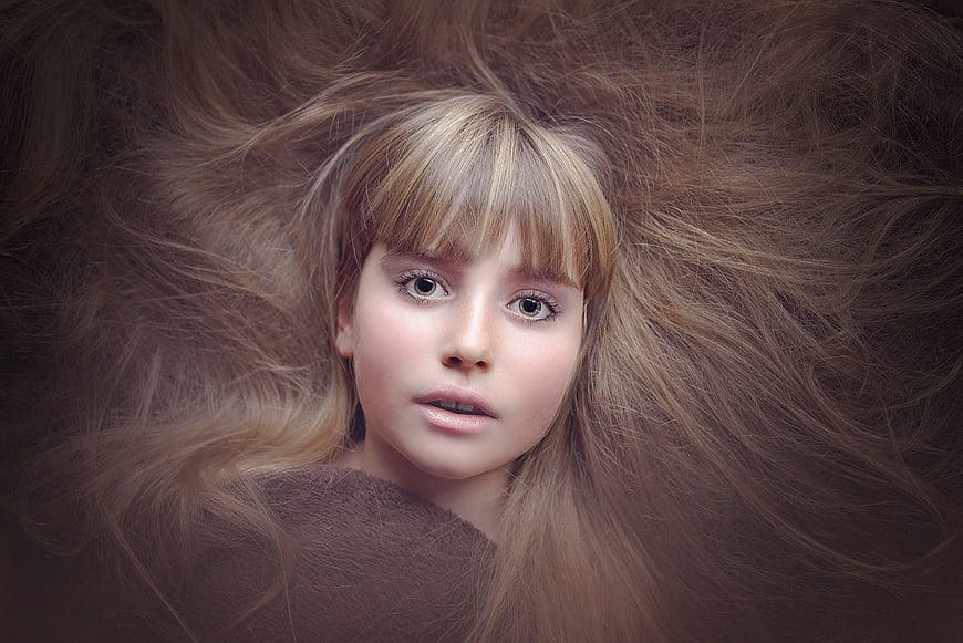 Portrait of a girl with voluminous flowing hair