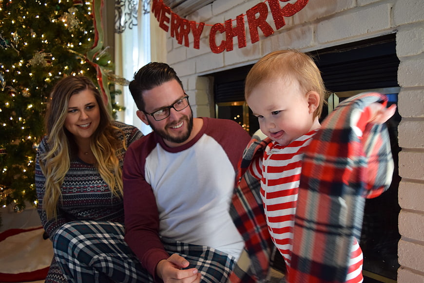 Happy family celebrating Christmas morning in cozy living room