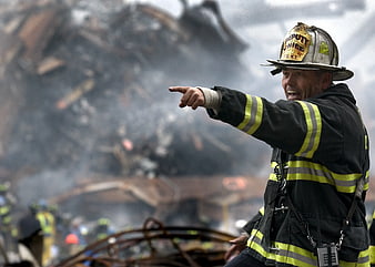 Firefighter Deputy Chief Pointing at Disaster Scene