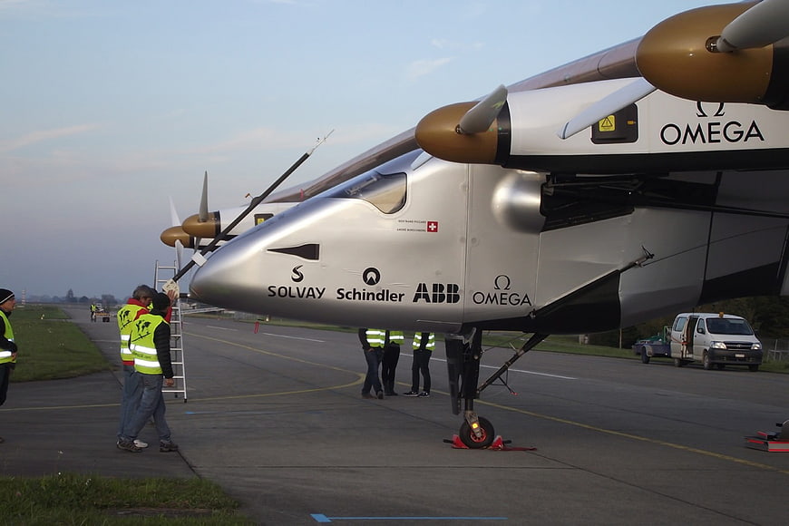 Solar Impulse 2 aircraft on runway with ground crew