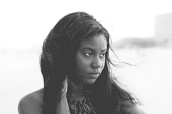 Black and white portrait of a young woman looking away