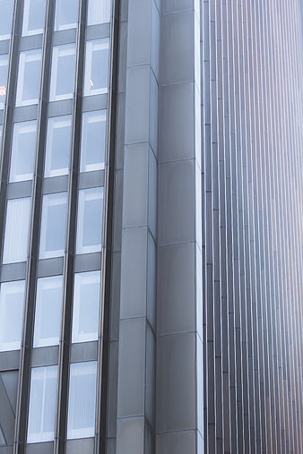 Modern Office Building Facade with Glass Windows and Metal Panels