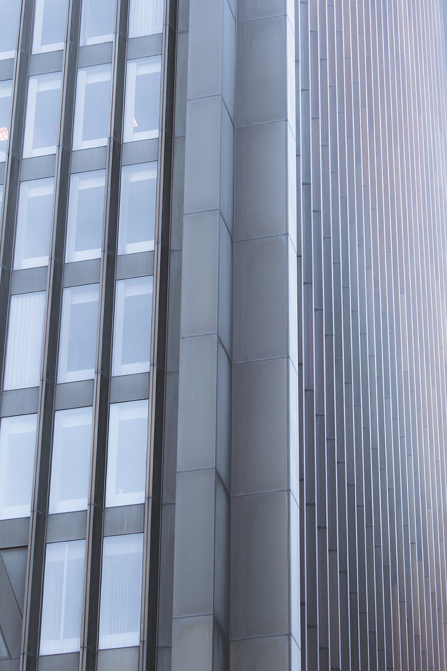 Modern Office Building Facade with Glass Windows and Metal Panels