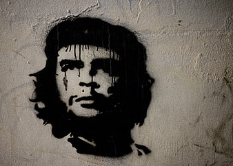 Black and white Che Guevara graffiti mural on textured wall