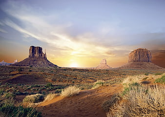 Monument Valley desert landscape with buttes at sunset