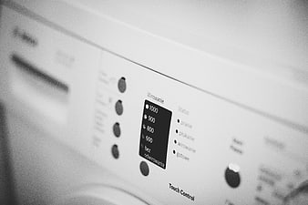 Close-up of washing machine control panel in black and white
