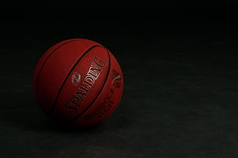 Red Spalding Basketball on Dark Background