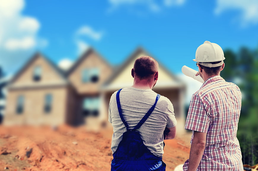 Architect and Builder Reviewing Construction Site