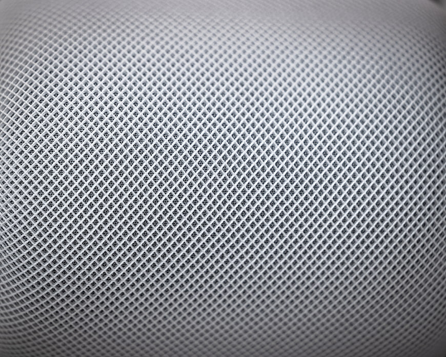 Close-up of white perforated mesh texture background