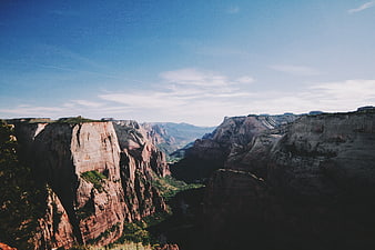 Majestic Canyon Landscape with Red Rock Cliffs and Blue Sky