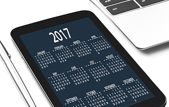 2017 Calendar on Tablet Screen with Laptop and Pen