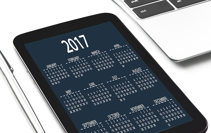 2017 Calendar on Tablet Screen with Laptop and Pen