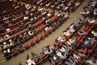 High angle view of audience in red auditorium seats