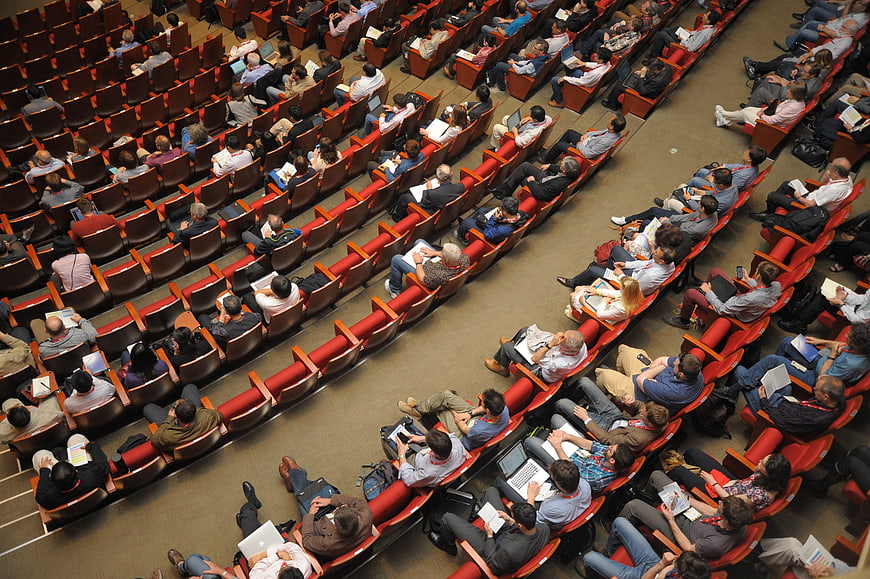 High angle view of audience in red auditorium seats