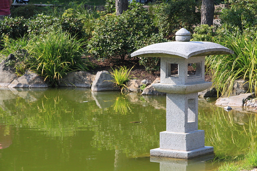 Stone Japanese Lantern in Serene Garden Pond