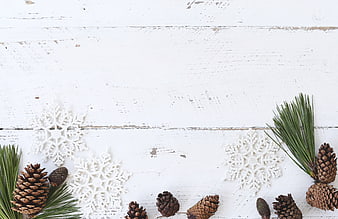 Rustic Christmas Flat Lay with Pine Cones and Snowflakes