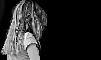 Sad Girl with Head Down in Black and White Portrait