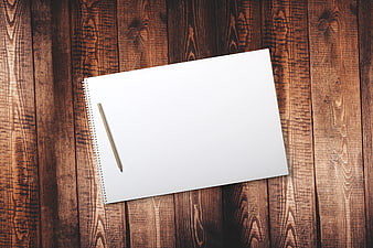 Blank Spiral Notebook and Pencil on Wooden Background