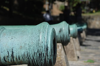 Row of weathered green cannons at Rumeli Fortress, Turkey