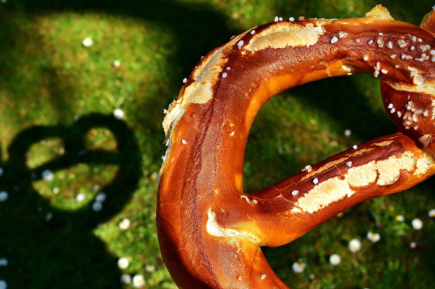 Close-up of Giant Bavarian Pretzel on Green Grass
