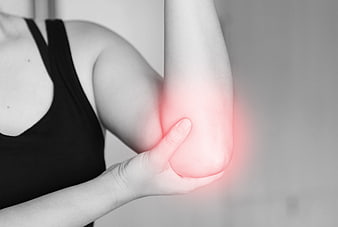 Woman holding elbow with red pain highlight