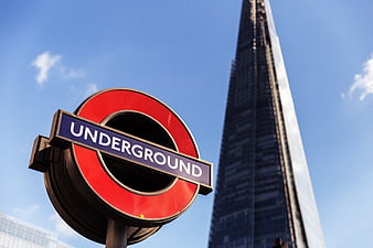 London Underground Roundel Sign With The Shard Building In Background