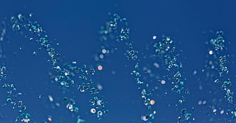 Abstract blue water bubbles rising underwater background