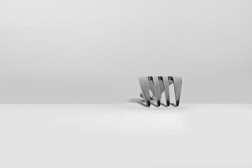 Minimalist Silver Fork on White Background