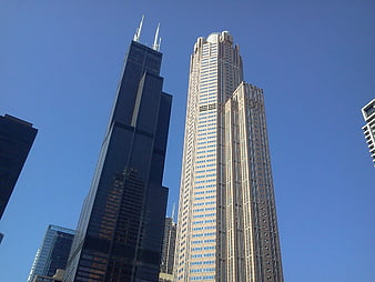 Low angle view of Chicago skyscrapers against blue sky
