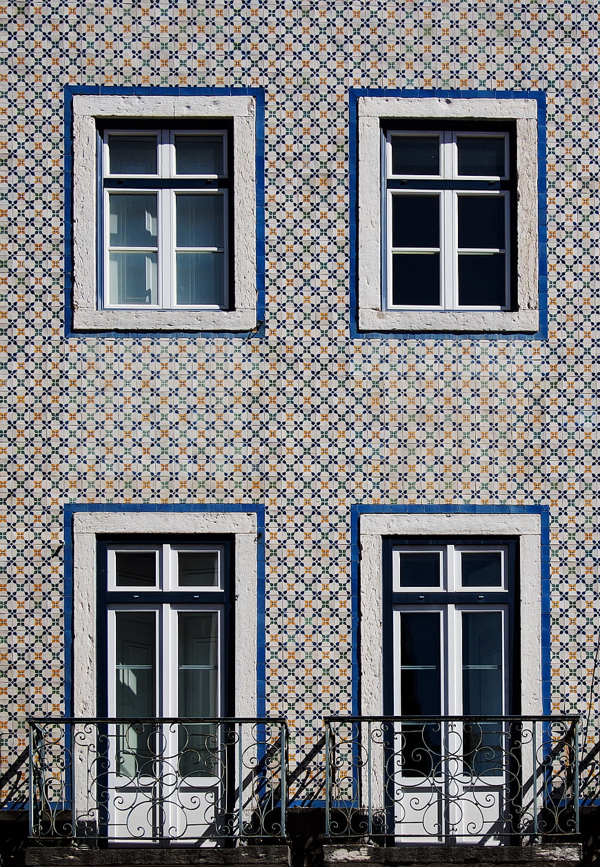Symmetrical facade with traditional Portuguese azulejo tiles and windows