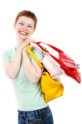 Happy woman holding colorful shopping bags isolated on white