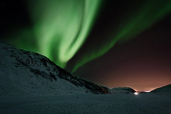 Vibrant Green Aurora Borealis Over Snowy Winter Landscape