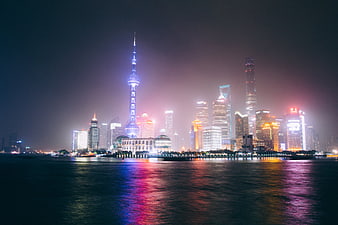 Shanghai Skyline at Night with Reflections on Water