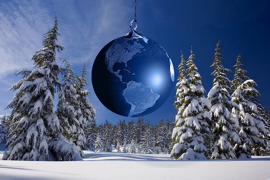 Blue Earth Christmas Ornament Hanging in Snowy Forest