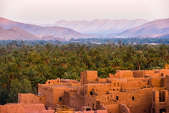 Traditional Ksar Architecture Overlooking Palm Oasis and Mountains