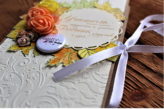 Handmade autumn greeting card with paper flowers and ribbon