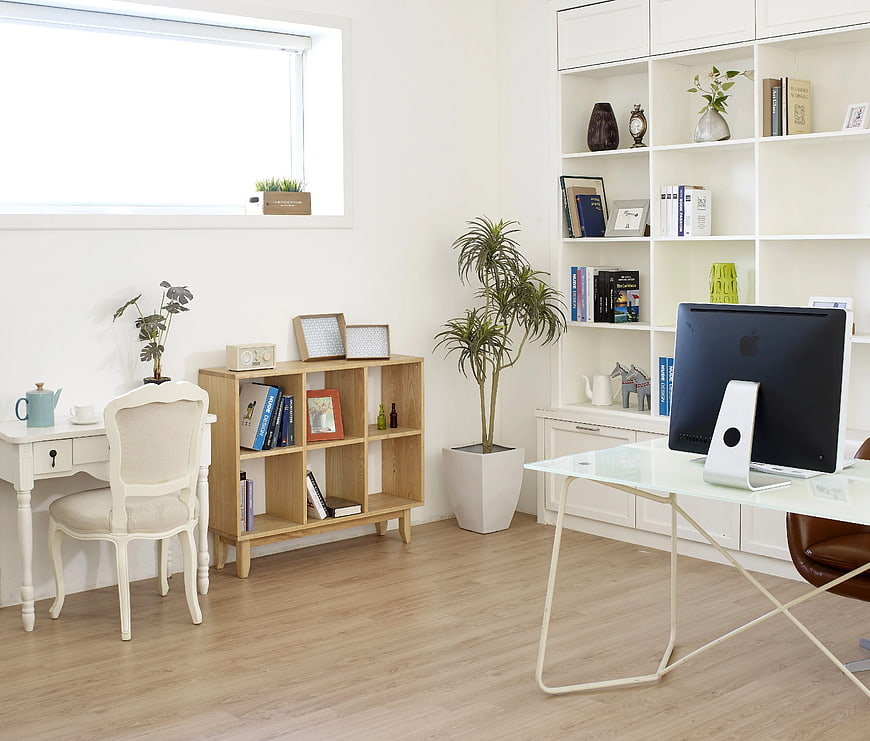 Bright modern home office with wooden furniture and white desk