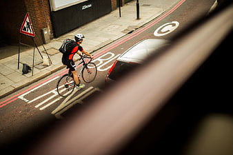 Cyclist Riding in City Bus Lane