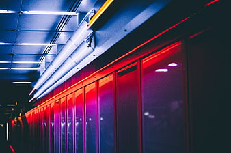 Abstract neon lights in modern architectural corridor