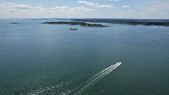 Aerial view of speedboat wake on blue ocean water